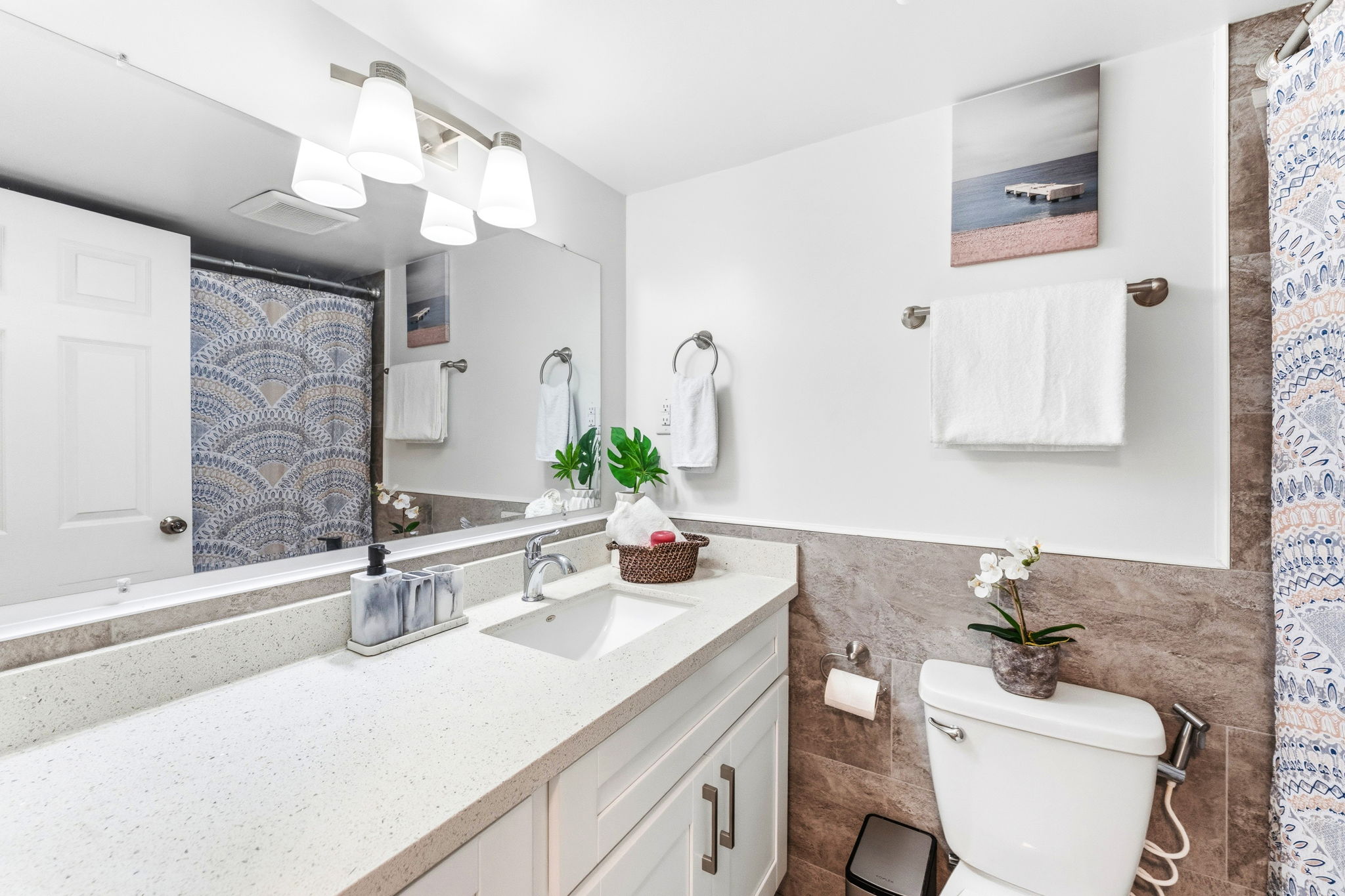 Full bathroom with quartz vanity